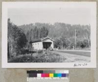 Covered Bridge, Oregon, over Mill Creek at Alsea Guard Station, Siuslaw National Forest, Highway 34. Alders left the Lombardy poplars rear. Metcalf. Oct. 1952