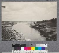 East Machias Harbor, Maine. Pulpwood at left from nearby property of Pejepscot Paper Company to be transported by water to Brunswick, Maine. Lumber on wharf at right ready to be loaded into schooner for transportation to market