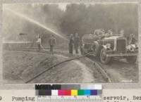 Pumping water from Summit Reservoir, Berkeley with O. Hirst's 90 horsepower Fageol fire truck. Pump has a capacity of 180 gallons per minute. W. Metcalf - July 1931