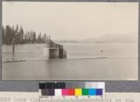 Lake Almanor from the dam built by the Great Western Power Company to make this large artificial lake. The trees on its edges are dying from the change in water level, yellow pines seeming to resist flooding longer than other species. W. Met July 1922