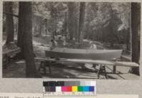 Camp Califorest. The camp adds a new boat to its equipment. Joe Wohletz '31, camp assistant, and Professor Fritz, with the boat half finished. E.F. July 1931