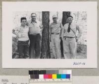 Fred Dunow & son & Fox of California Department of Forestry with Metcalf at Fred Charles Place in Calaveras County. Charles is clearing most of this to plant walnuts. July 1952. Metcalf