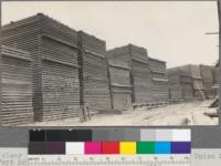 Thick clear redwood piled for air-drying in yards of Union Lumber Company. Fort Bragg, California. May, 1920. E. F