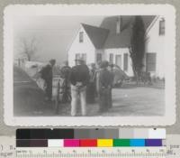 (right) N.D. Hudson talk to farmers about treating fence posts for longer life. Fresno County, January 1945. Metcalf. #2