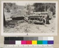 Rolling down and burning brush near King City, Monterey County. H. H. Phelps. Forest Ranger. 1930. Tractor and brush roller attached