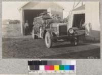 Elk Grove rural fire outfit at the fire hall with Justice Everson, Secretary of the Fire District. Metcalf. 1928