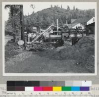 Redwood Region. A very small shingle mill at Navarro, Humboldt County, California owned and operated by J. Bartlett. One shingle saw. Unique feature is bolted on ground level, and the use of a Johnson (agricultural) elevator (made in Woodland) to raise bolts to sawing floor. 2-13-47. E.F