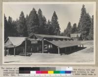 The center of activities at the 4-H Camp at Whitaker's Forest is the dining hall and cook house rebuilt after the fire of August, 1947. The headquarters building in the background was constructed in 1928 and rebuilt after going down under heavy snow in 1932. November, 1948