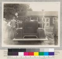 Rear view of new Mack rural fire truck at Davis, October 1930. Note central tank and hose compartments on each side. Cost $6,000, list. Fairbank