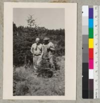 Woodbridge Metcalf, Extension Forester, and Nat Crouch, Christmas tree grower of Monterey County. Tree is a good Abies concolor - background Douglas firs. Summer of 1952