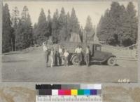 Truck #10 after hauling a load of cots to Whitaker's Forest with Crose, Linebarger and McKenny at the clearing with headquarters in the background. 1937. Metcalf