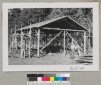 Herb Plumb & Carl Nordstrom, Issaquah, Wash. Framework for a barn Carl is building. Metcalf. Sept. 1952