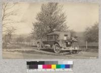 The rolling country in New York east of Cayuga Lake is particularly beautiful in spring when the cherries are in bloom. Breakfast beside the road near Dryden, May 1924