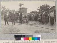 Fairbanks explains use of extinguishers at the Newman demonstration, Stanislaus County. Metcalf. May, 1928