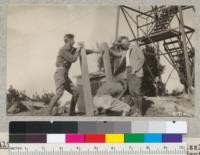 Installing weather equipment on Grizzly Peak, September 1, 1927. Lookout Reuter, Warden Jordan, Professor Malmsten and Mr. Gray of the U.S. Weather Bureau