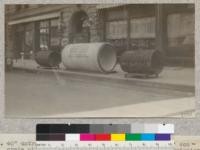 40" untreated Douglas fir wood stave pipe and 54" concrete pipe in front of office of Denver Water Commission, Denver, Colorado. Left hand pipe in service 22 years, right hand in service 3 years. Both badly decayed. May 8, 1921