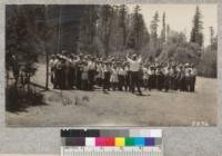 We sing "We're for Club Work" on the Camp Loma parade ground. July, 1930