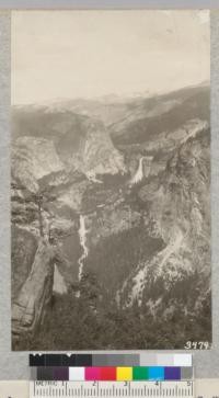 Nevada Falls and Vernal Falls with the wide sweep of high mountain country from a point on the trail to Illouette Creek from Glacier Point. Metcalf, 1925