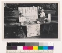 Professor Woodbridge Metcalf and exhibits used in forestry demonstration at 33rd annual 4-H Club Convention, Davis campus, University of California. "How Forest Trees Grow." September 1953