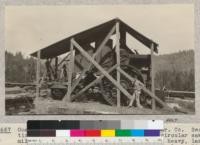 One of the white elephants of the Madera Lumber Company. Section 28 T 3 N R 17 E. This was a small, circular sawmill and the lumber was transported on very heavy, large-wheeled trucks from the north fork of the Tuolomne River to a point on the Standard Lumber Company's logging railroad near Confidence. The picture shows one of the large steam tractors used for hauling trains of trucks. The mill was abandoned about 1920