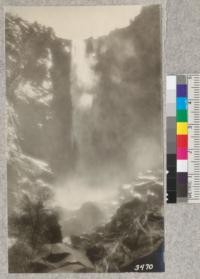 A misty view of Bridalveil falls, Yosemite Valley, from the creek, June 23, 1925. Metcalf. 1925