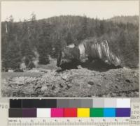 Stump field south of Scotia. Stumps being removed by a modified charcoal-kiln process. Photo shows a large stump on fire. Each has been heaped into the burned openings. In this case stump was too large to cover entirely. Top part will be burned. See also 5795 and 5797. March 1935. E. F