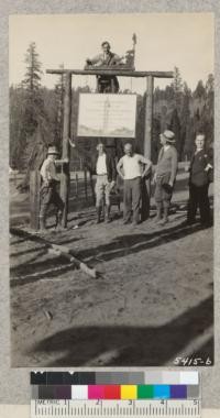 Putting up the new sign at the entrance to Whitaker's Forest 4-H club camp area, April 1931. Designed and made by Norton. Those in picture, Ralston, Berriman, Norton, Brown, Metcalf, and Sorenzini