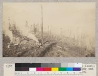 Redwood Utilization Project. Looking at landing from upper flat. Left to right, flyer and loader. Incline lateral, incline, and Eel River shown. C.R.B. Dec. 1929