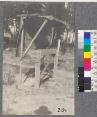 Feather River Experiment Station. The canopy threading board for use in threading seedlings in the board. The canopy prevents drying out from wind and sun. Canopy usually comes over the sides of the frame. The notched board is the planting board. Seedlings after threading are held by a string. Simliar to the Lytel Creek Board at Pilgrim Creek