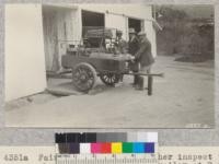 Fairbank, Hedges and Tocher inspect the chemical fire-fighting trailer at Rancho del Justo, San Benito County. Walter Hedges, the County Fire Warden, cooperated most generously in the demonstration. Metcalf. May, 1928