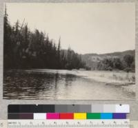 Looking down South Fork of Eel River from McMath place at Phillipsville, California. On slope to left, trees are leaning due to slow land slide. Open hill in distance above Maple Hills is densely covered with St. Johns Wort. 7-22-32. E.F