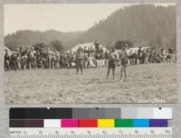 Two of the Indians in the Indian Stick Game between teams from Hoopa and Requa which was part of the dedication ceremonies of the Klamath River Bridge. May 17, 1926