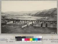 Portion of Grand Coulee Dam partly completed on west side of river. 1937. Metcalf