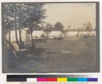 Michigan Agricultural College, Department of Forestry. Views taken during the 6 weeks term of the Summer School 1910. General view of west side of Camp street. Students at work in the open. At the headquarters of the Public Domain Commission, Rosommon County, Cold Springs on Higgins Lake, Michigan