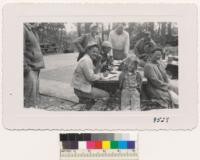 Keith Bissel, Orville Burnside, Ray Isle and other 4-H leaders discuss finances of the new Las Posadas kitchen which cost about $2600 to build but which is worth much more. June 1950. Metcalf