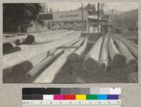 Second growth redwood poles in the yard of the local power company in Guerneville, California. June 1924, E.F