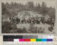 The Santa Cruz forestry tour makes a stop at a fire line near the Redwood Park where J. Price, Fire Specialist of the Forest Service explained some features of cooperative fire protection, and Dr. John C. Merriam said a few words about research as fundamental to successful handling of natural resources. Metcalf. 1927