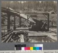 Drag saw and jack ladder showing boy washing log of dirt etc. Spanish Peak Lumber Company, Quincy, California. August, 1920. E.F