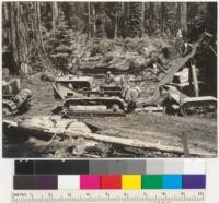 Redwood Region. Tractors (RD8 Caterpillar) pulling a heavy redwood butt log. Two tractors in tandem. Jordan Creek operation, Pacific Lumber Company. Panoramic with #6888. 6-11-41. E. F