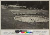 The stage and two fire bowls at the campfire circle, White Oak Flat 4-H Club Camp, built by Civilian Conservation Corps program, Spring of 1936. Metcalf