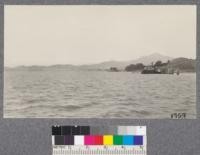 View of point San Quentin from the Richmond Ferry, with Mt. Tamalpais in the background. August, 1921