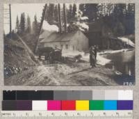 Unloading logs from trucks at the pond of the Spanish Peak Lumber Company, Meadow Valley, California