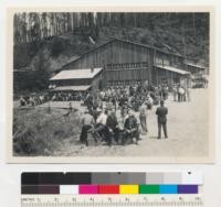 Redwood Logging Conference, at lunch May 21, 1943 at camp of Holmes Eureka Lumber Company, Salmon Creek near Fortuna, California. Selectively logged stand on ridge in background. Logged in 1942. See also 7202. 5-21-43. E. F