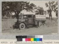 At the close of the trip, headed towards Berkeley, under the oaks in Contra Costa County, after visting 10 counties and demonstrationg to over 2800 people. Metcalf. 1928