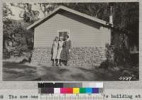 The new camp hospital and caretaker's building at White Oak Flat 4-H Club camp, Santa Barbara County. June 1932. The camp nurse and two of the girls are shown. The building was completed by the camp committee shortly before camp started. 1932. Metcalf