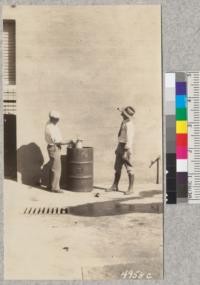 Blowing the lid of a can to demonstrate explosive power of "empty" gasoline containers. As shown by Metcalf and Fairbank, 1929