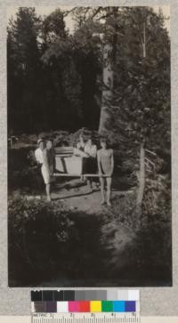 Camp Califorest. Between the end of the road and the lake the new rowboat is carried on cross sticks to the tune of a funeral march. E.F. July, 1931