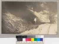 The water in Malibu Creek was 8 ft. deep over this part of the road during the height of the flood. The watershed is pretty well covered with brush and trees but the watersoaked soil would not absorb the heavy rainfall. March 1938. Metcalf