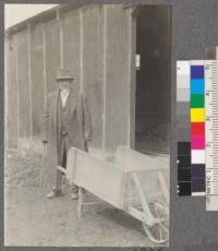 Mr. T. J. Gillespie who for many years made Eucalyptus lumber and insulater pins from trees cut in the vicinity of San Jose, California. The wheelbarrow is made of Eucalyptus