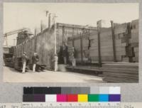 Dry kiln of the E. K. Wood Lumber Company, Oakland, California. With portion of Forestry 112 making notes. September, 1925